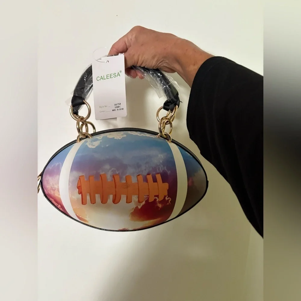 NWT-whimsical tie-dyed clouds  Pristine pebbled Rugby football purse gold chain